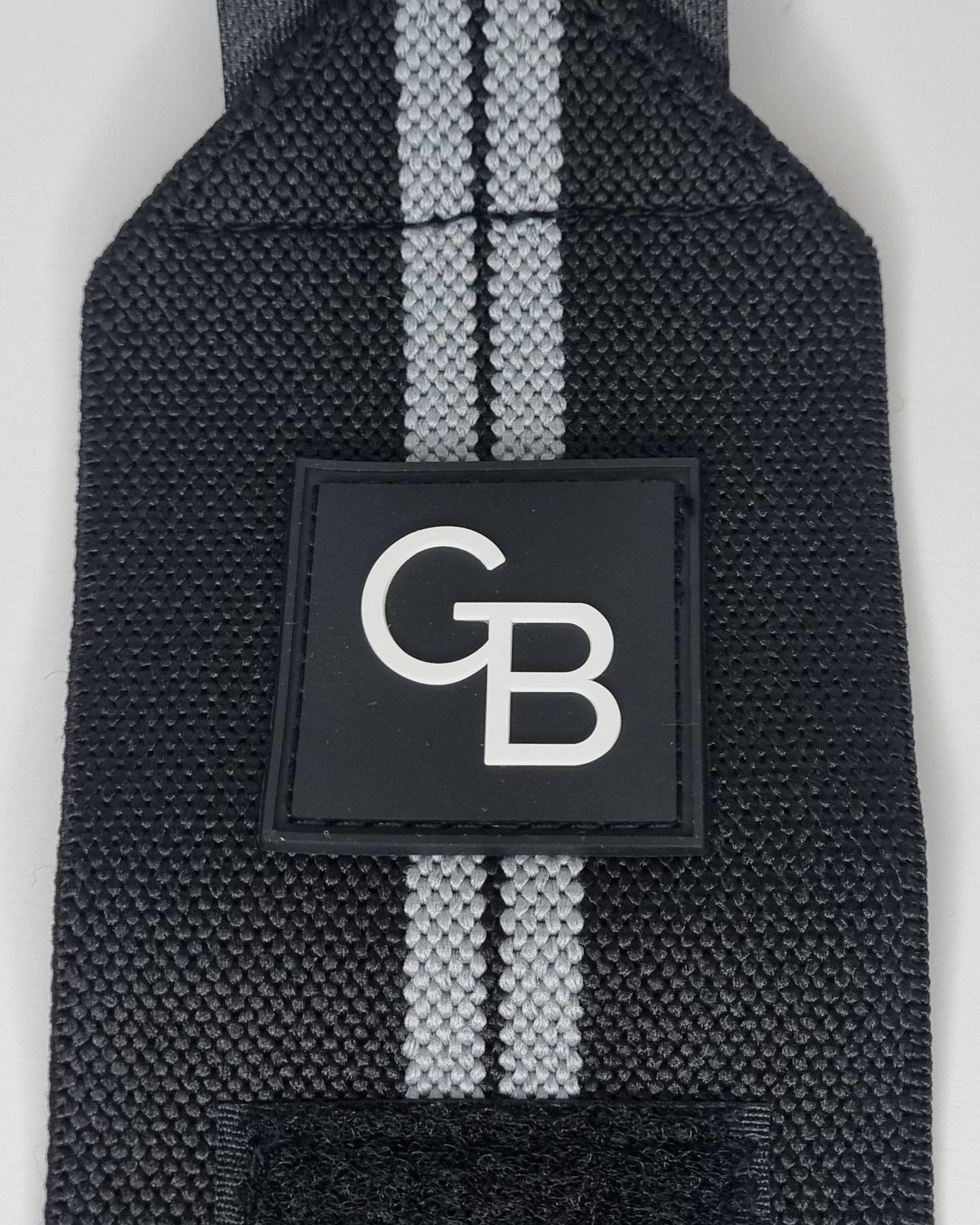 Wrist wraps, wrist support, push day essentials (logo close-up view)
